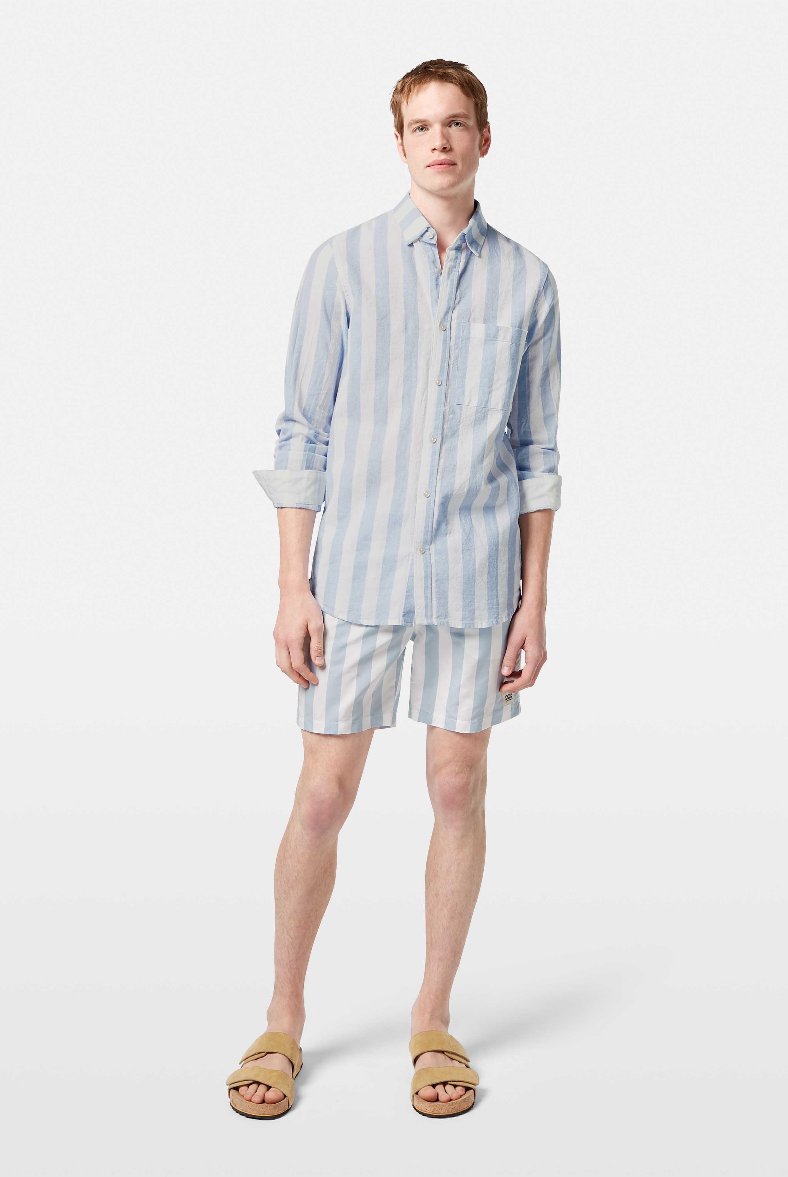 This lightweight long-sleeved seersucker shirt features classic stripes and a textured finish, blending comfort with effortless style.
100% Cotton
Regular fit